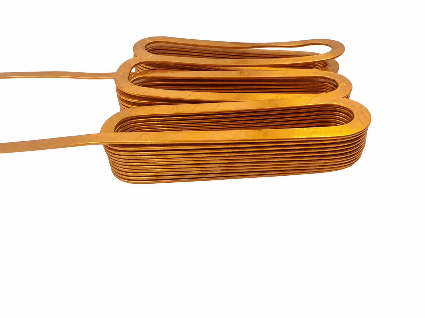 Three connected oblong flat copper strip winding packs, with layered turns and two leads exiting to the left.