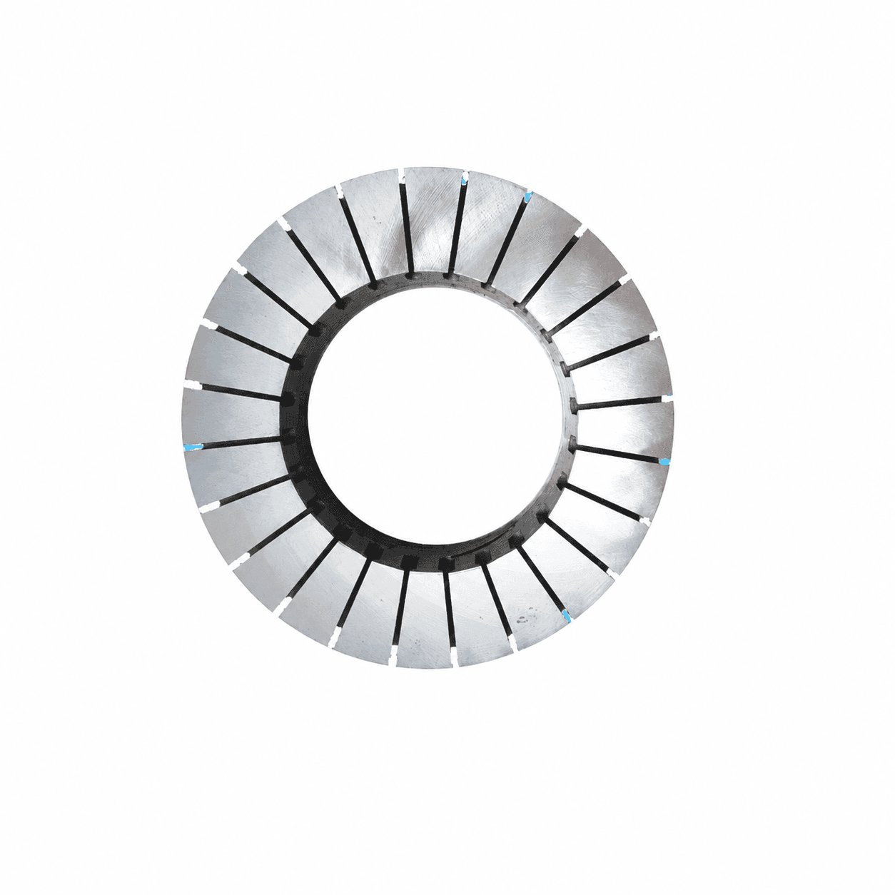 Silver stator lamination ring with radial open slots, central bore, machined tooth faces and small blue edge marks.